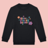 sweat-noir-chuuut-secret-fille Sweat noir enfant devant illustration "chuuut j'ai un secret" rose, orange et bleu + fleurs.